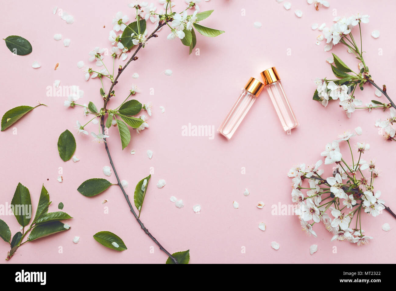 Two bottles of perfume with apricot blossom Stock Photo Alamy