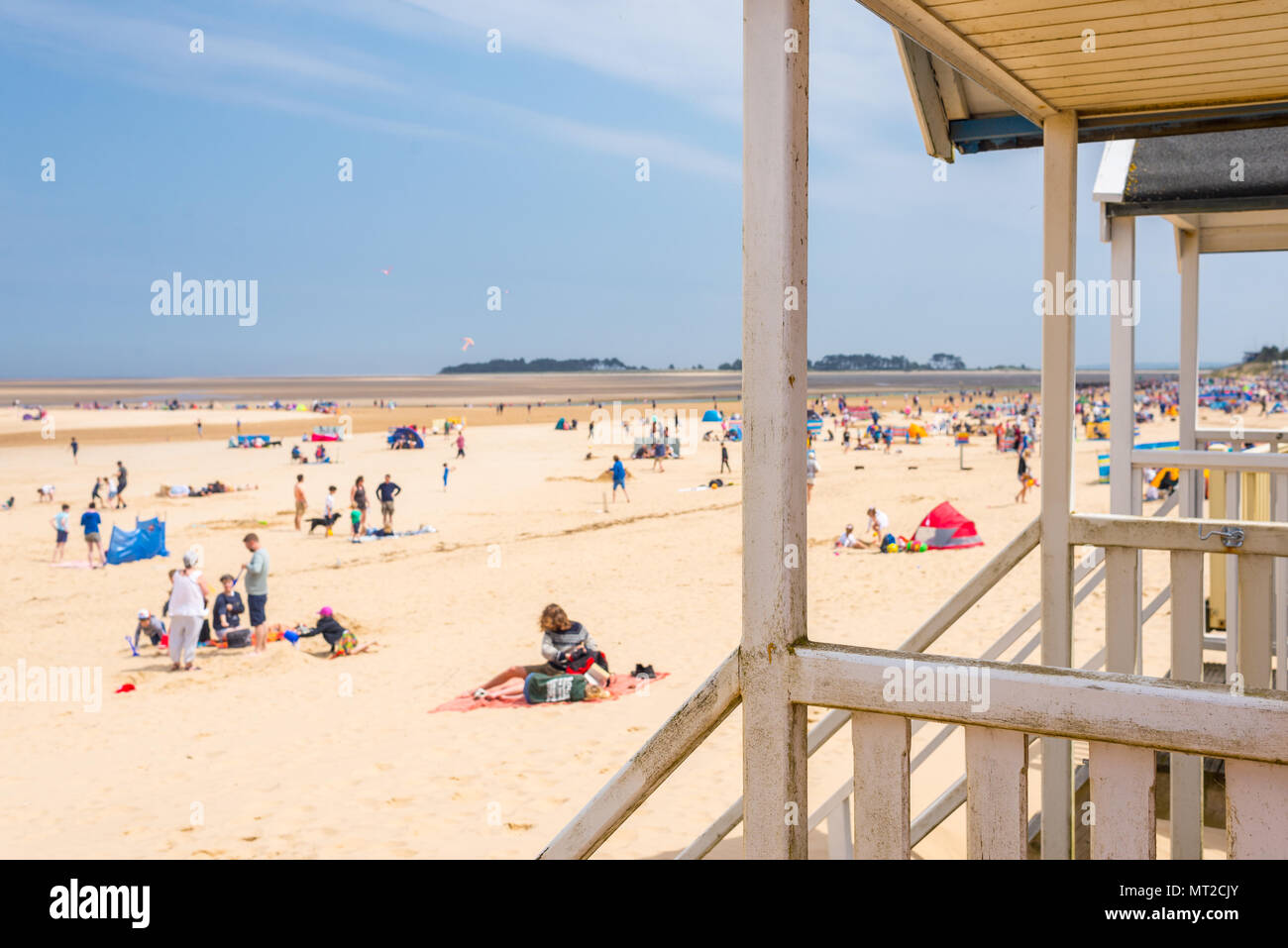 Wells-next-the-Sea, Norfolk, UK. 27th May 2018. People enjoying the sunny warm day during the Bank Holiday weekend  on the beach in Norfolk. Credit: Nicola Ferrari/Alamy Live News. Stock Photo