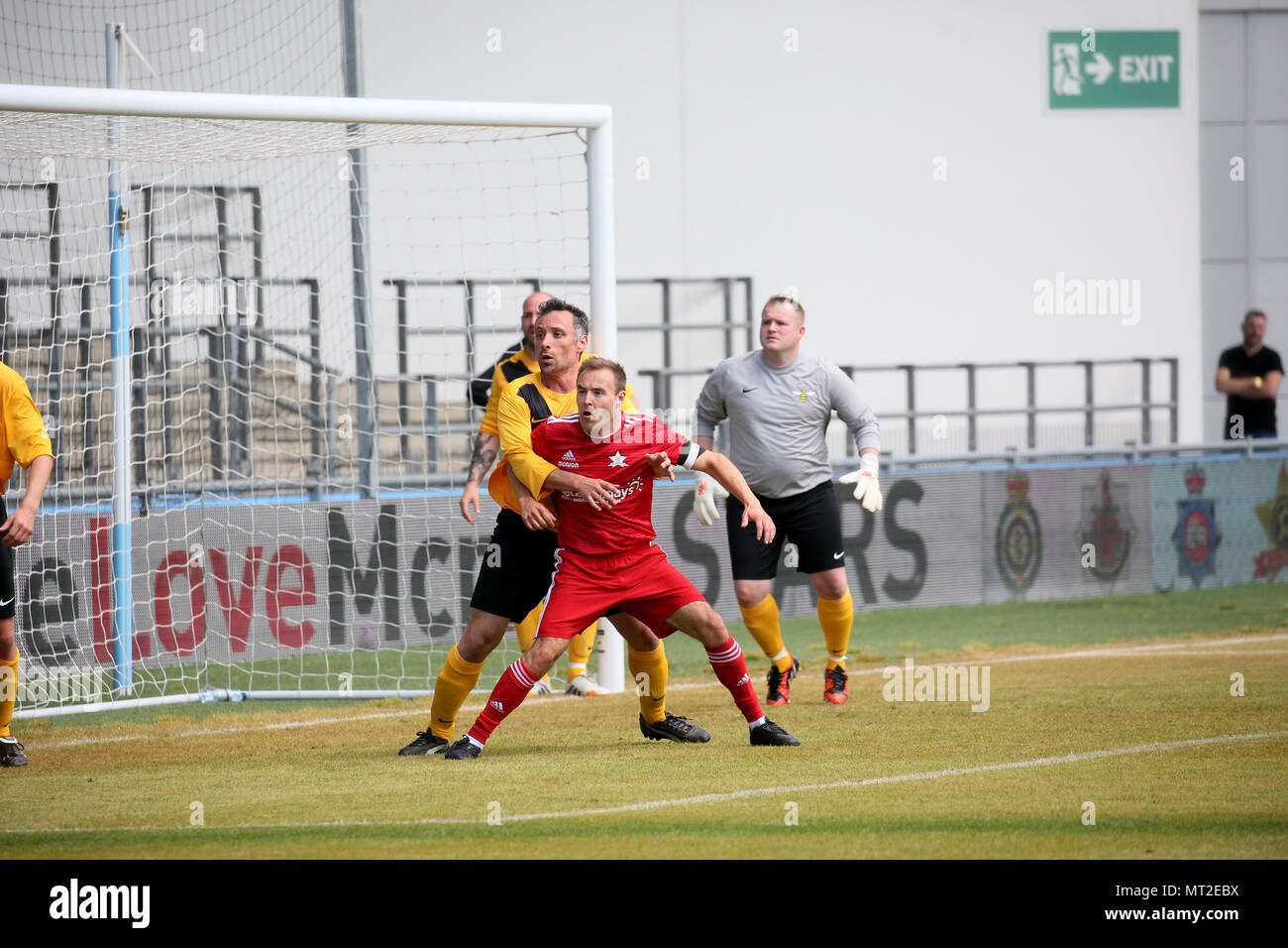 Manchester, UK. 28th May 2018. Celebrities in red shirts go head to head for 'We Love Manchester all-star football match'at Manchester City Academy to raise money for the charity that supports those affected by the Manchester Arena attack.  The emergency services team, which includes police officers, fire and ambulance crews will play against a Jet2holidays TV Allstars side represented by players from Coronation Street, Hollyoaks and Emmerdale in aid of the 'We Love Manchester Emergency Fund',,Manchester City Academy, Manchester, 27th May, 2018 (C)Barbara Cook/Alamy Live News Stock Photo