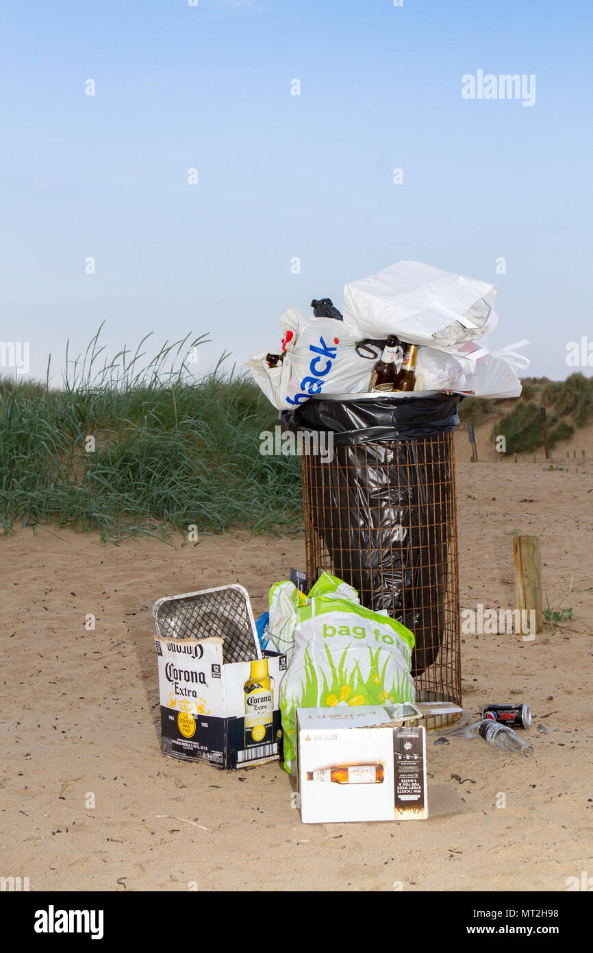 Filthy Beach, Southport, Merseyside. 28th May 2018. Bank Holiday revellers leave Southport’s beaches strewn with rubbish, discarded barbecues and empty beer cans.  Beauty spots were covered in litter and bags of rubbish were piled-up next to overflowing bins.  Many simply left their rubbish behind after having barbecues and drinks in the great outdoors - forcing local clean up squads to leap into action today. While some attempted to clear up by placing their litter near a bin, the nature spots were still blighted by mountains of festering rubbish.  Credit: Cernan Elias/Alamy Live News Stock Photo