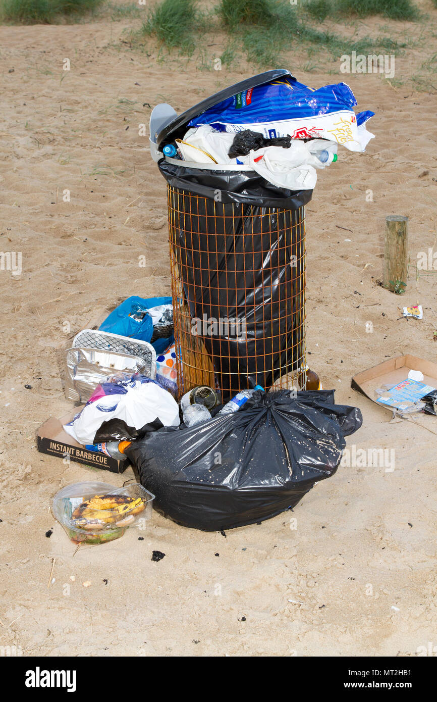 Filthy Beach, Southport, Merseyside. 28th May 2018. Bank Holiday revellers leave Southport’s beaches strewn with rubbish, discarded barbecues and empty beer cans.  Beauty spots were covered in litter and bags of rubbish were piled-up next to overflowing bins.  Many simply left their rubbish behind after having barbecues and drinks in the great outdoors - forcing local clean up squads to leap into action today. While some attempted to clear up by placing their litter near a bin, the nature spots were still blighted by mountains of festering rubbish.  Credit: Cernan Elias/Alamy Live News Stock Photo