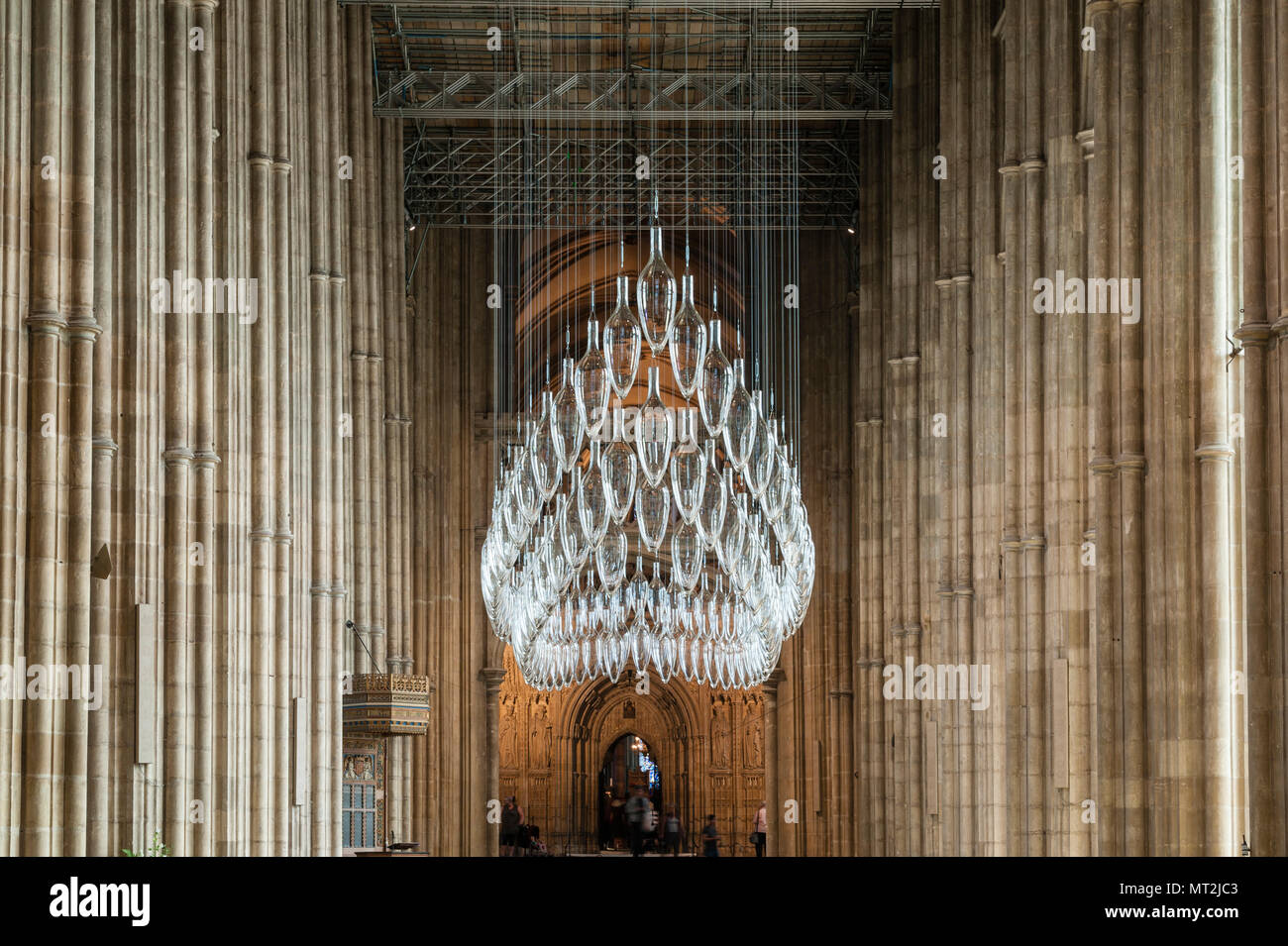 Canterbury, UK. 27th May, 2018. 'Under An Equal Sky', a major art installation is opened in Canterbury Cathedral. It marks the centenary of the end of the First World War. The work is by the artists Monica Guggisberg and Philip Baldwin, who work mostly in glass. This piece, hanging in the nave of the cathedral, is called 'Boat of Remembrance' and refers to, among other things, the refugee crisis in the Mediterranean. Stock Photo