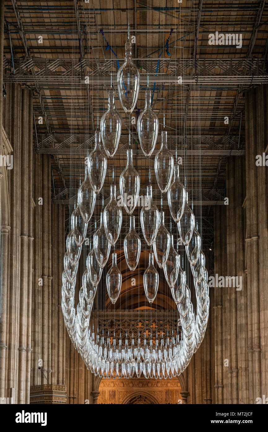 Canterbury, UK. 27th May, 2018. 'Under An Equal Sky', a major art installation is opened in Canterbury Cathedral. It marks the centenary of the end of the First World War. The work is by the artists Monica Guggisberg and Philip Baldwin, who work mostly in glass. This piece, hanging in the nave of the cathedral, is called 'Boat of Remembrance' and refers to, among other things, the refugee crisis in the Mediterranean. Stock Photo