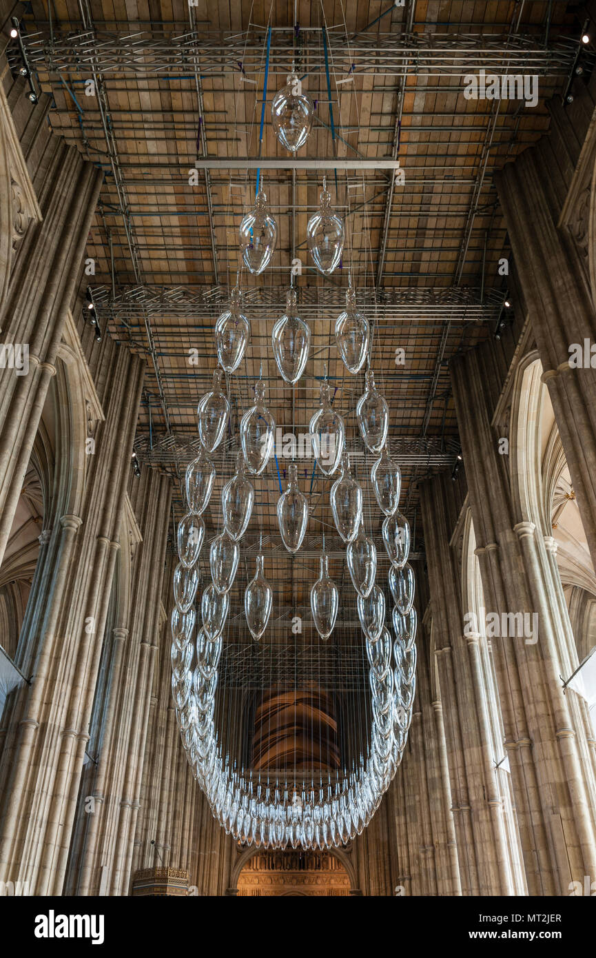 Canterbury, UK. 27th May, 2018. 'Under An Equal Sky', a major art installation is opened in Canterbury Cathedral. It marks the centenary of the end of the First World War. The work is by the artists Monica Guggisberg and Philip Baldwin, who work mostly in glass. This piece, hanging in the nave of the cathedral, is called 'Boat of Remembrance' and refers to, among other things, the refugee crisis in the Mediterranean. Stock Photo