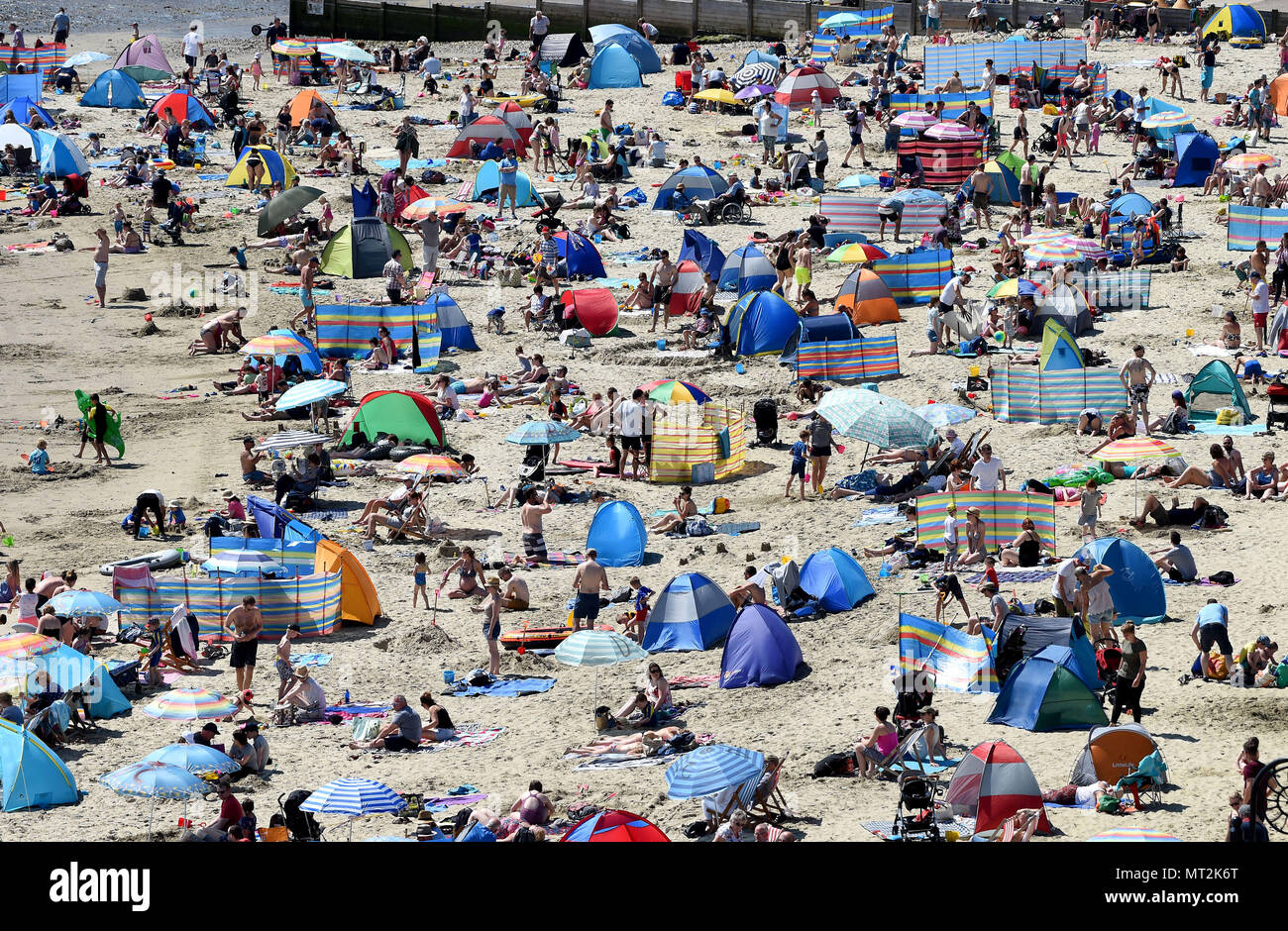 Lyme Regis, UK. 28th May 2018. Bank Holiday weather at Lyme Regis beach, Dorset. Credit: Finnbarr Webster/Alamy Live News Stock Photo