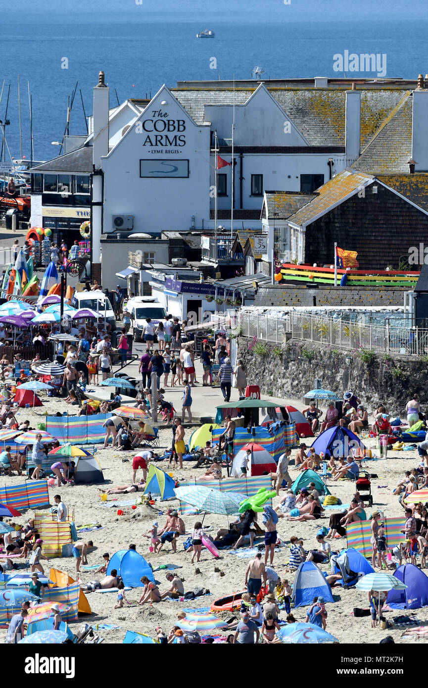 Lyme Regis, UK. 28th May 2018. Bank Holiday weather at Lyme Regis beach, Dorset. Credit: Finnbarr Webster/Alamy Live News Stock Photo