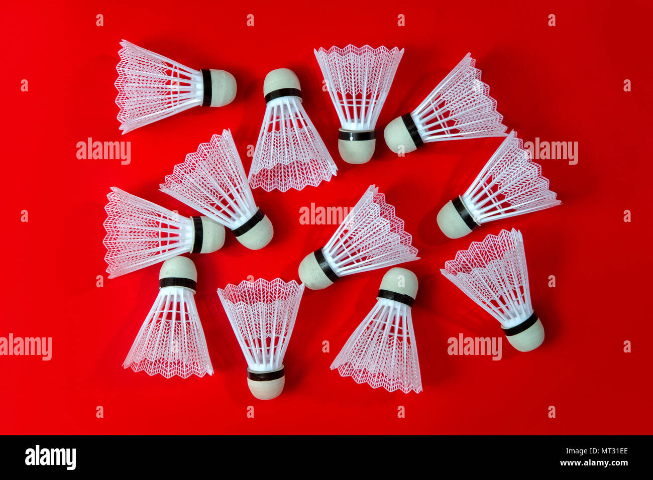 Badminton shuttlecocks against a red background Stock Photo Alamy