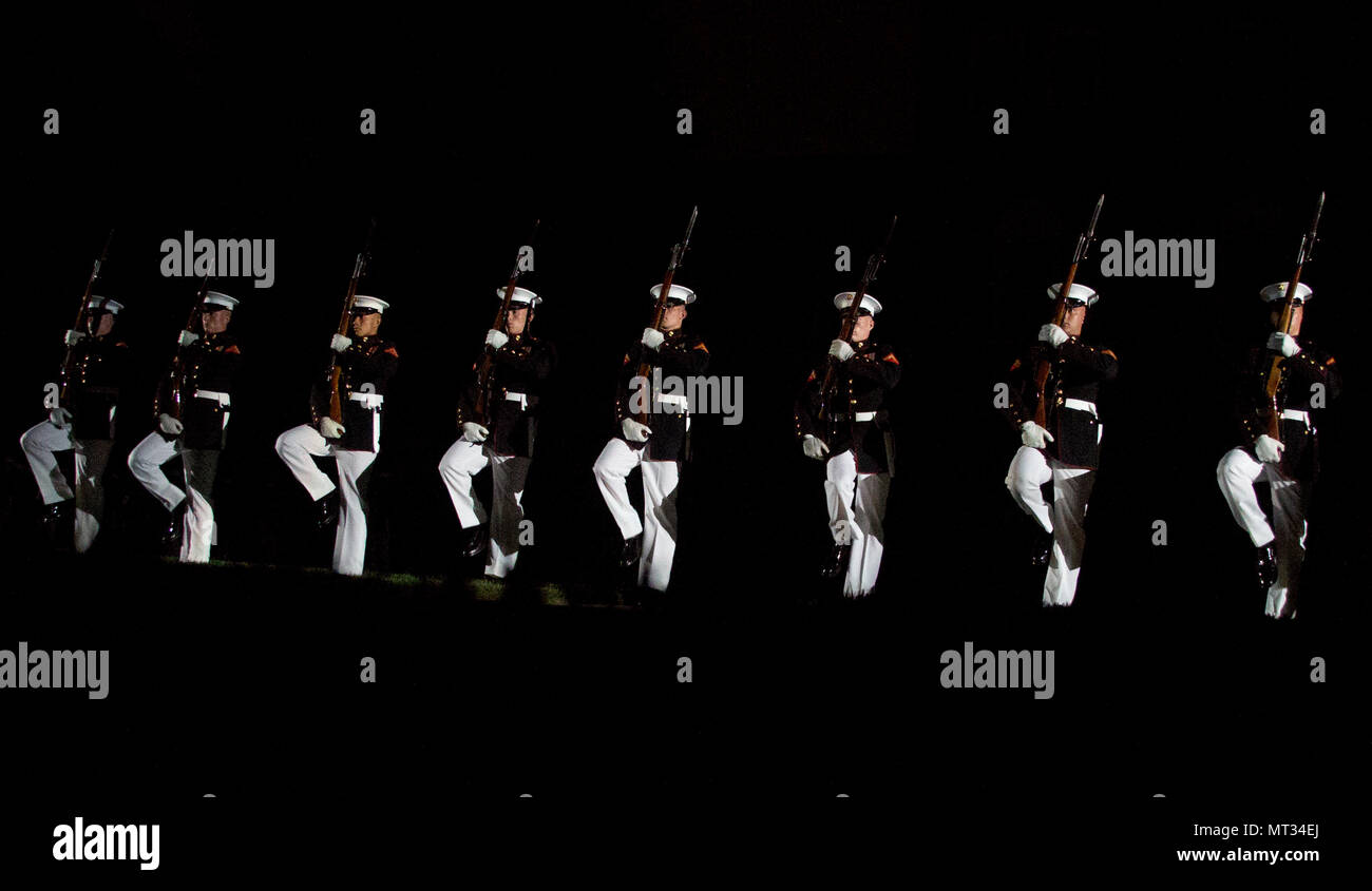 Marines with the U.S. Marine Corps Silent Drill Platoon execute precision rifle drill movements