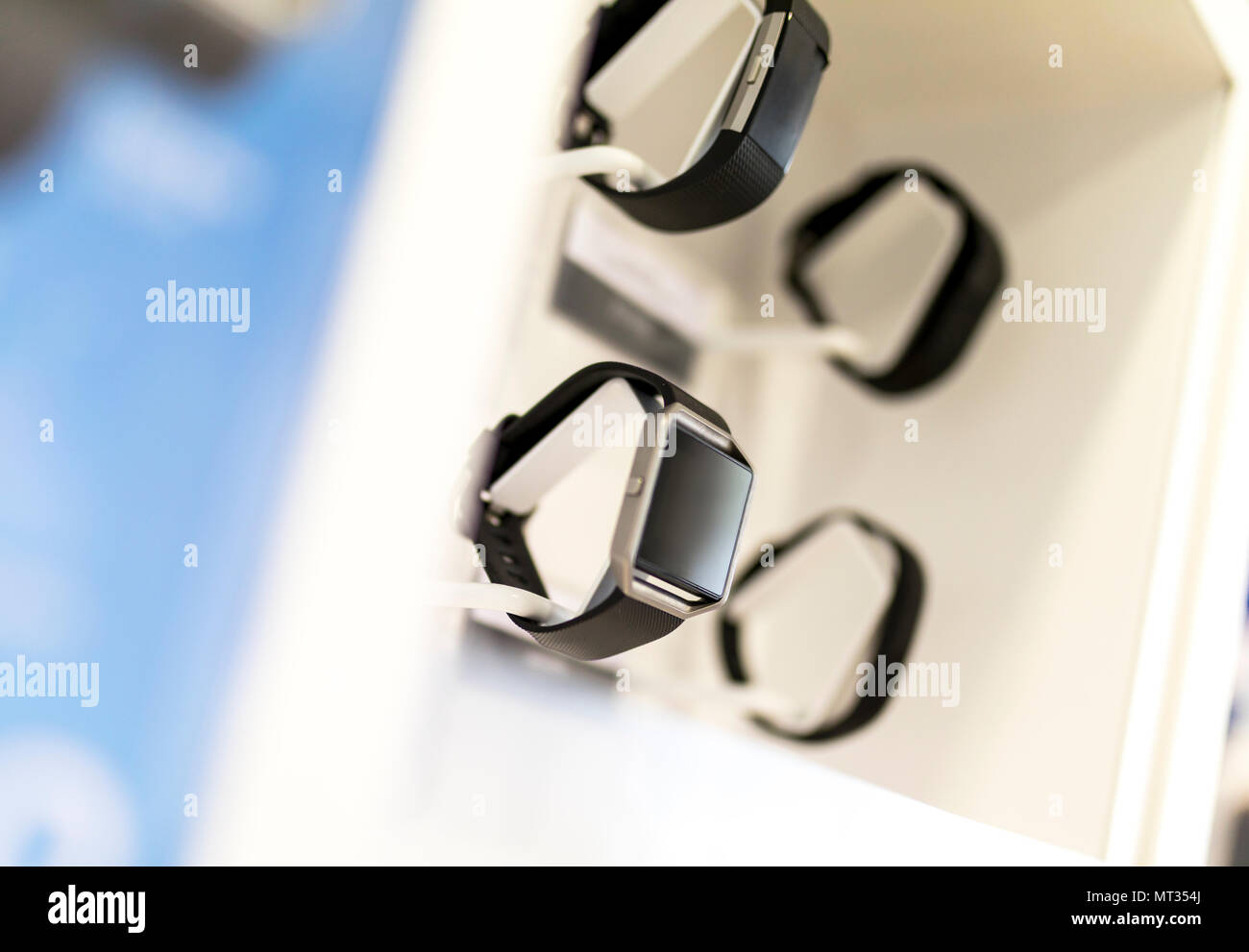 Smart watches and gadgets on display in a retail environment in a shop