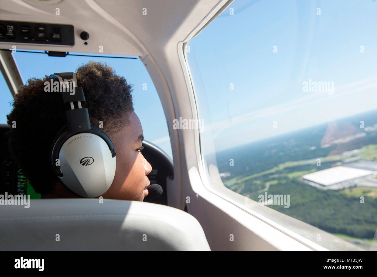 A Valdosta youth overlooks the skies as he copilots a Piper Archer