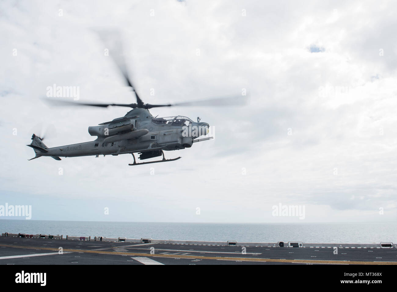 170723-N-NB544-305 CORAL SEA (July 23, 2017) An AH-1Z Viper, assigned to the 'Dragons' of Marine Medium Tiltrotor Squadron (VMM) 265 (Reinforced), 31st Marine Expeditionary Unit (MEU), takes off from the flight deck of the amphibious assault ship USS Bonhomme Richard (LHD 6) during Talisman Saber 17. Talisman Saber is a biennial U.S.-Australian bilateral exercise held off the coast of Australia meant to achieve interoperability and strengthen the U.S.-Australian alliance. (U.S. Navy photo by Mass Communication Specialist 2nd Class Kyle Carlstrom/Released) Stock Photo