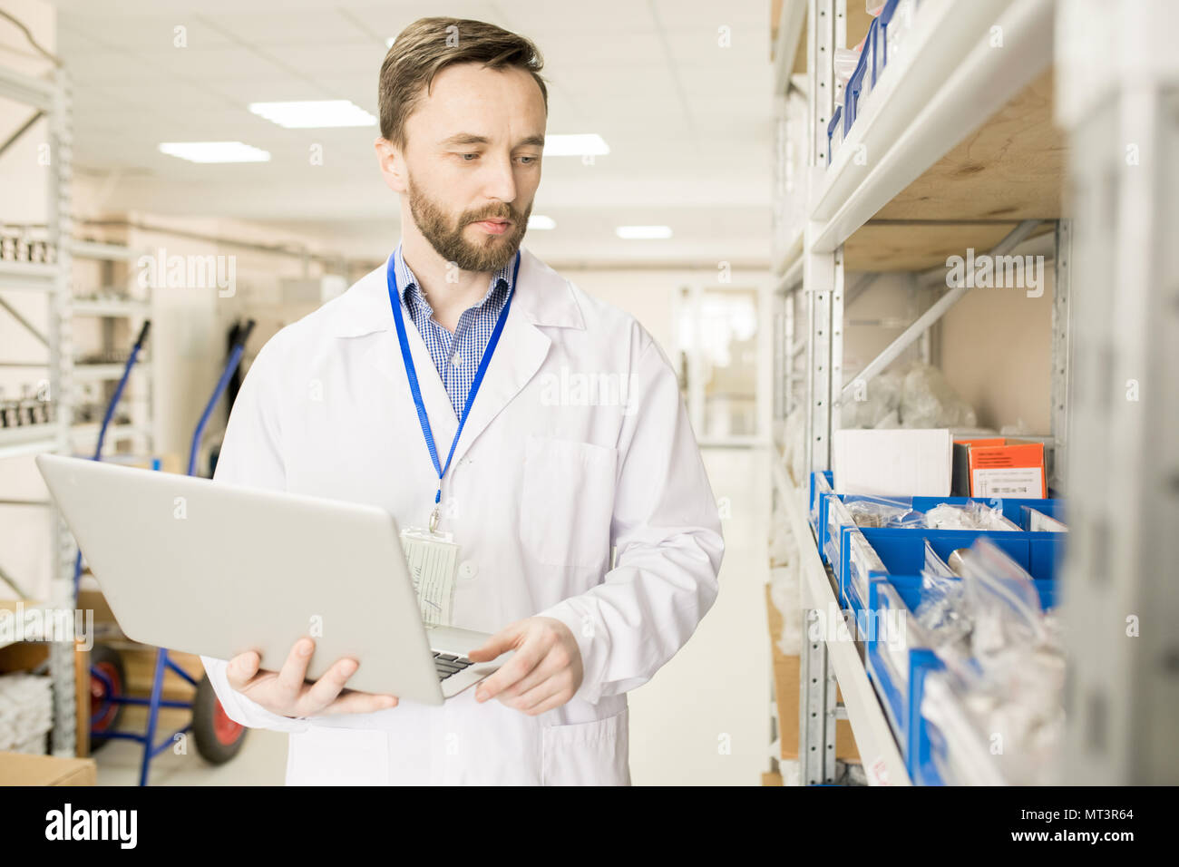 Modern technical engineer preparing goods for export Stock Photo