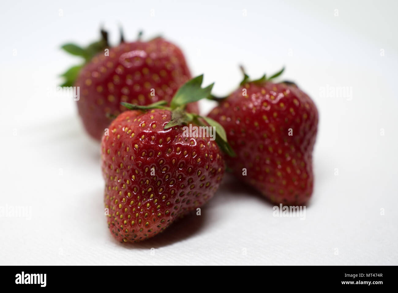 Three Fresh Strawberries Stock Photo - Alamy