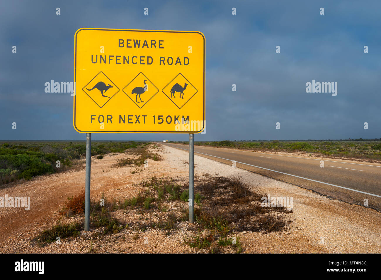 Outback road sign at the Eyre Highway. Stock Photo