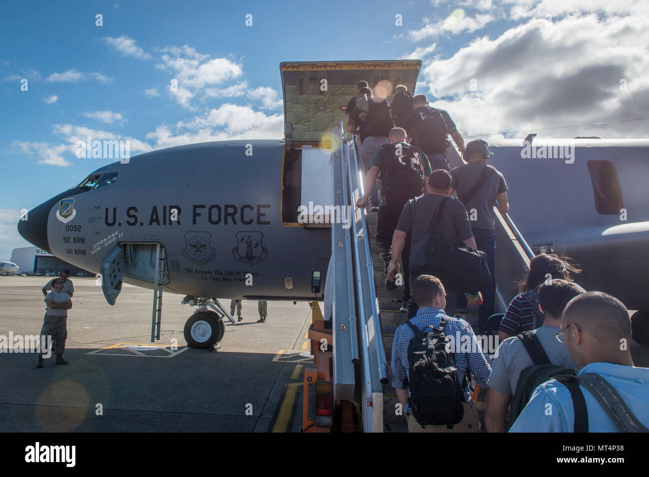 Pacific Angel (PACANGEL) 17-3 main body personnel board a U.S. Air Force KC-135 Stratotanker, assigned to the 92nd Air Refueling Wing from Fairchild Air Force Base, Wash., for their return flight home at the airport in Nadi, Fiji, July 25, 2017. The active duty KC-135, flown by a crew completely comprised of Washington Air National Guard Citizen Airmen, provided the primary means of air transportation for PACANGEL 17-3 mission personnel, cargo and supplies. The KC-135 and its crew ensured the operation could execute by sustained rapid global mobility and continuous regional development through Stock Photo