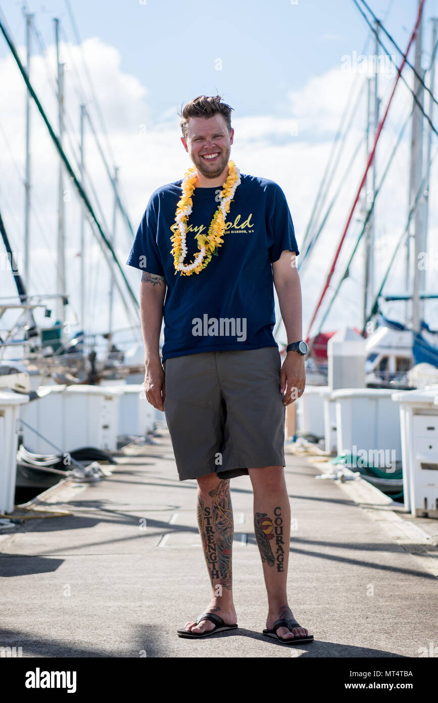 170727-N-KC128-0388 PEARL HARBOR, Hawaii (July 27, 2017) Brian Buggea, a member of the crew of 'Stay Gold,' poses for a photo on the pier at Rainbow Mariana July 27, 2017, after sailing from Washington State to Pearl Harbor, Hawaii in a sailboat. (U.S. Navy photo by Mass Communication Specialist 1st Class Daniel Hinton) Stock Photo