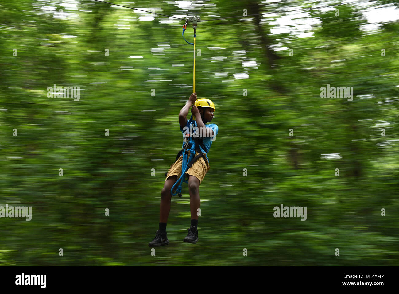 Jaheim Moseby, a Gold Star member, rides a zip line June 15, 2017