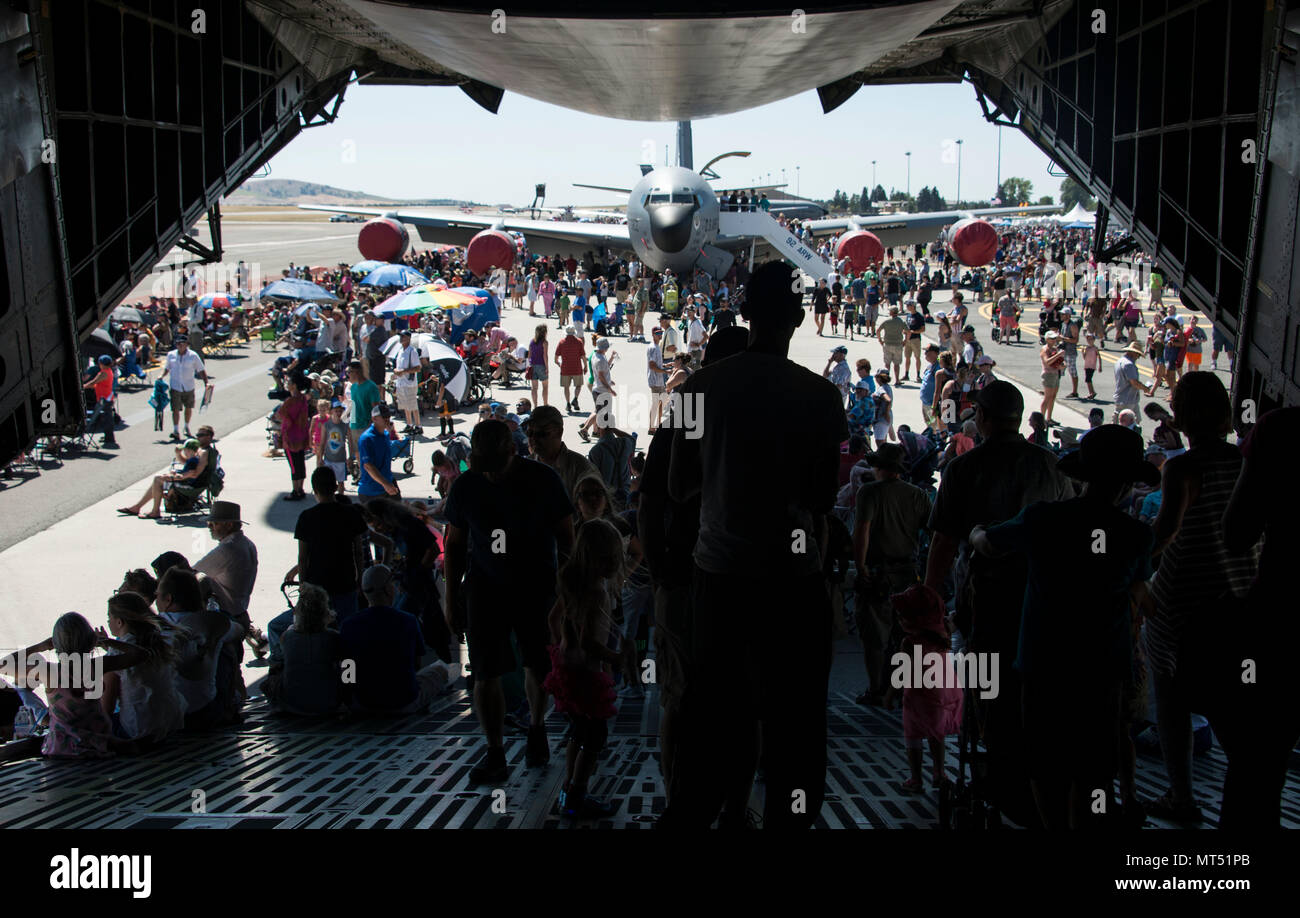 Service members and members from the local community walk off a C-5 Galaxy during SkyFest 2017 Air Show and Open House at Fairchild Air Force Base, Washington, July 29, 2017. SkyFest is Fairchild’s air show and open house to give the local and regional community the opportunity to meet Airmen and learn about the Air Force mission. (U.S. Air Force photo/Senior Airman Janelle Patiño) Stock Photo
