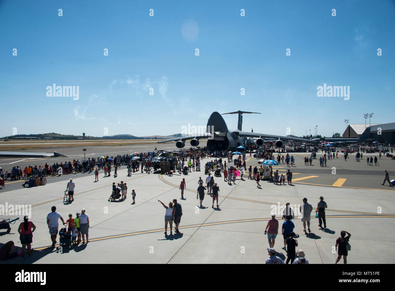 Service members and members from the local community gathered at Fairchild Air Force Base, Washington, during the SkyFest 2017 Air Show and Open House at Fairchild Air Force Base, Washington, July 29, 2017. SkyFest is Fairchild’s air show and open house to give the local and regional community the opportunity to view Airmen and our resources. (U.S. Air Force photo/Senior Airman Janelle Patiño) Stock Photo