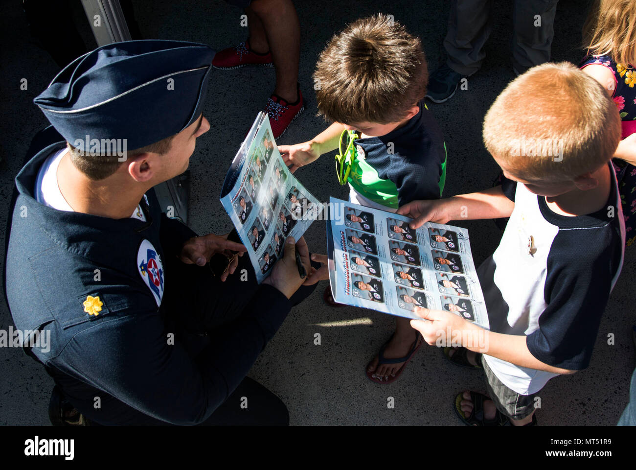 Maj. Whit Collins, U.S. Air Force Aerial Demonstration Squadron “Thunderbirds” pilot #6 signs autographs for the local and regional community during SkyFest 2017 Air Show and Open House at Fairchild Air Force Base, Washington, July 28, 2017. SkyFest was an opportunity to give the local and regional community a chance to view Airmen and our resources. (U.S. Air Force photo/Senior Airman Janelle Patiño) Stock Photo