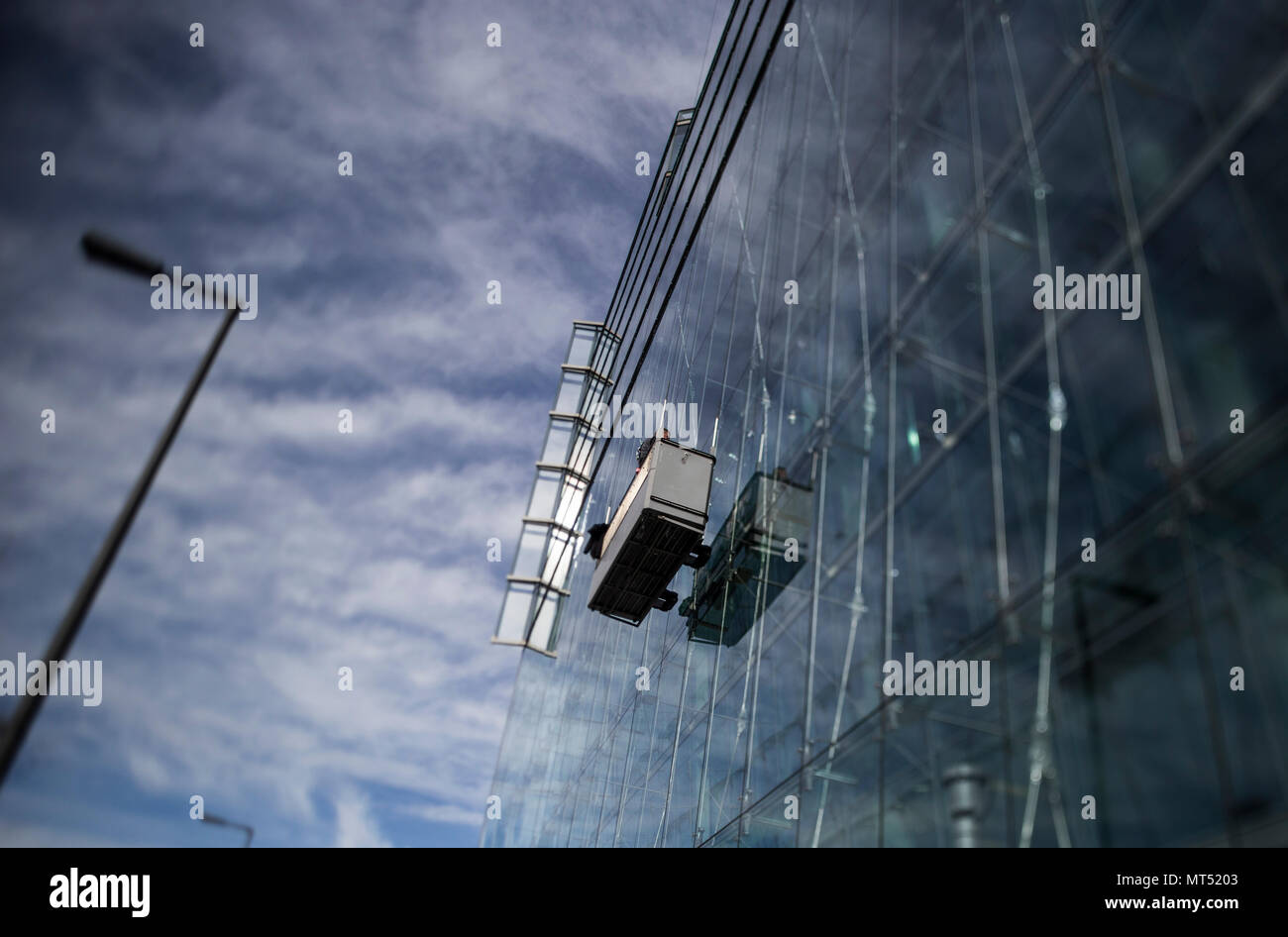 Window cleaners at work on an office building in Berlin, Germany Stock