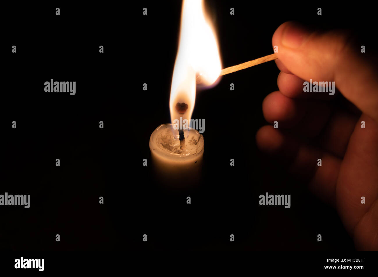 Burning candle matchstick hires stock photography and images Alamy