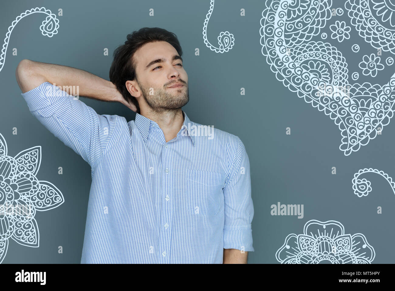 Cheerful teacher looking into the distance and waiting for holidays Stock Photo