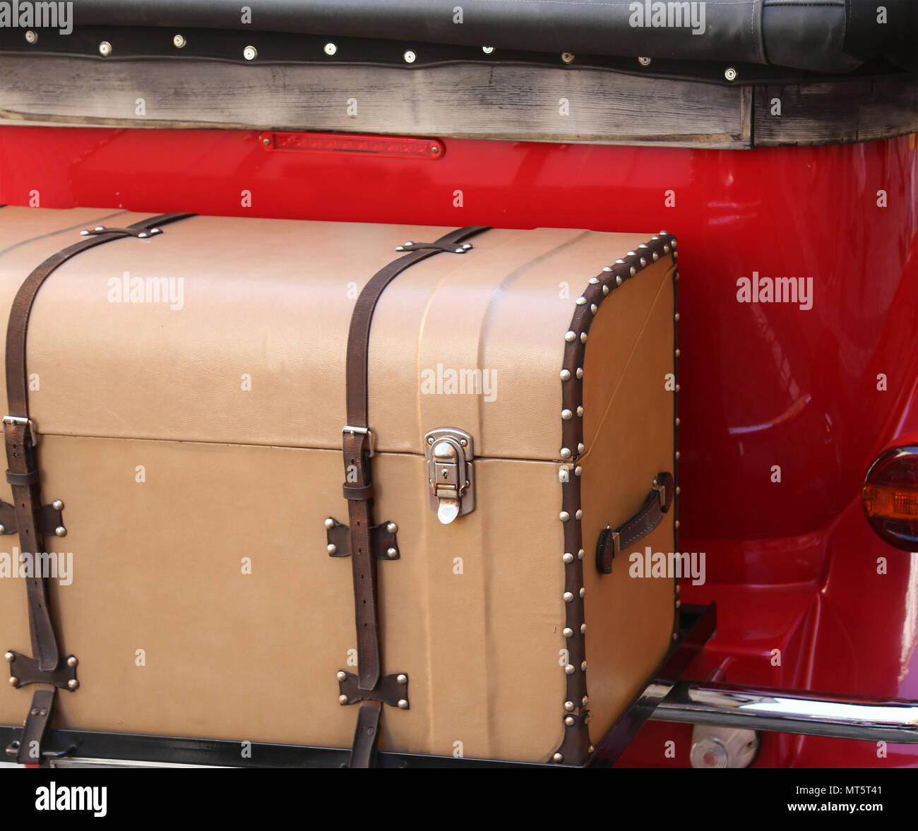 Antique vintage trunk attached to a vintage red car Stock Photo - Alamy
