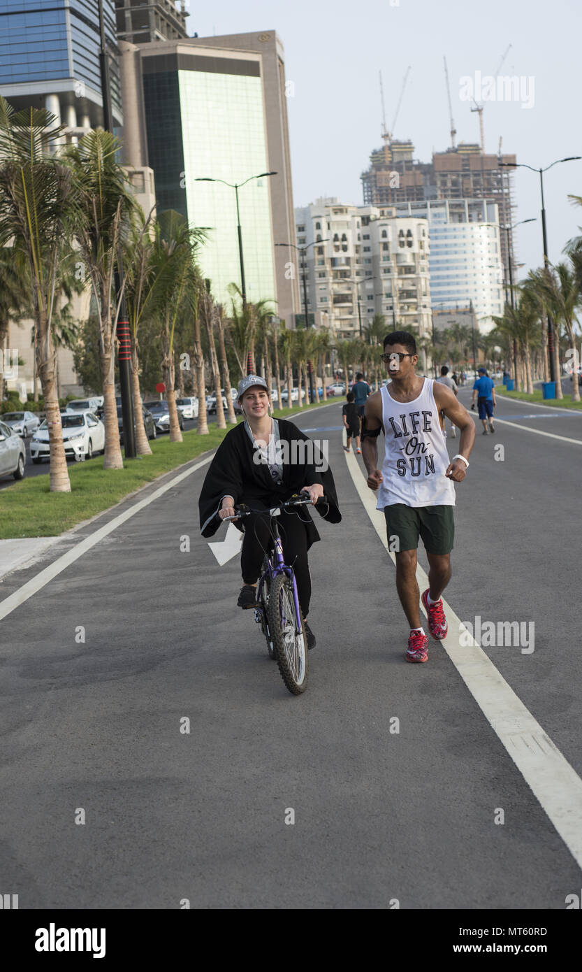 Egyptian man and Syrian women exercising on the Corniche in Jeddah Saudi Arabia on the new running track Stock Photo