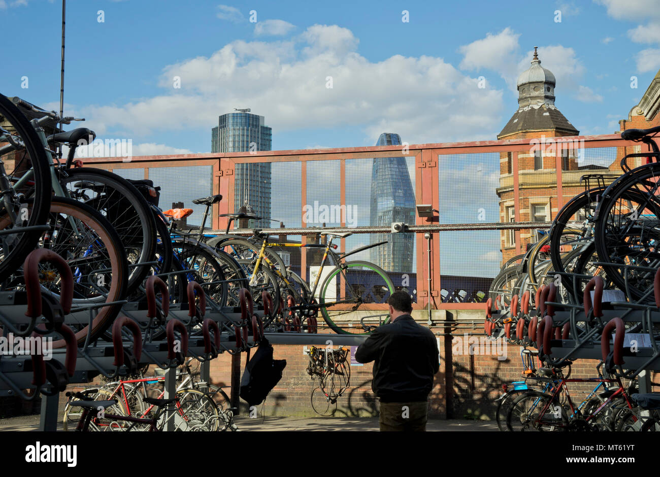 Bicycle parking racks with views of skyscrapers and designer luxury