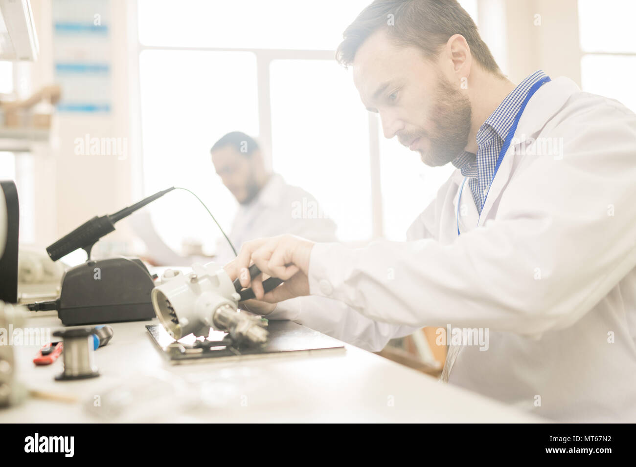 Experienced technician repairing pressure gauge Stock Photo Alamy