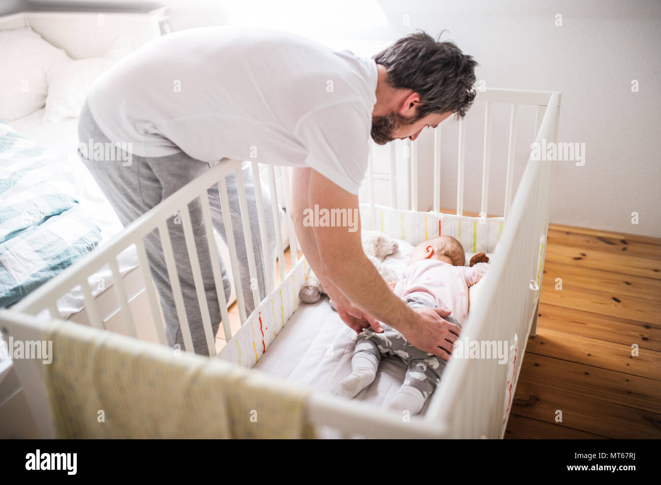Father And Daughter Sleeping Bed High Resolution Stock Photography and