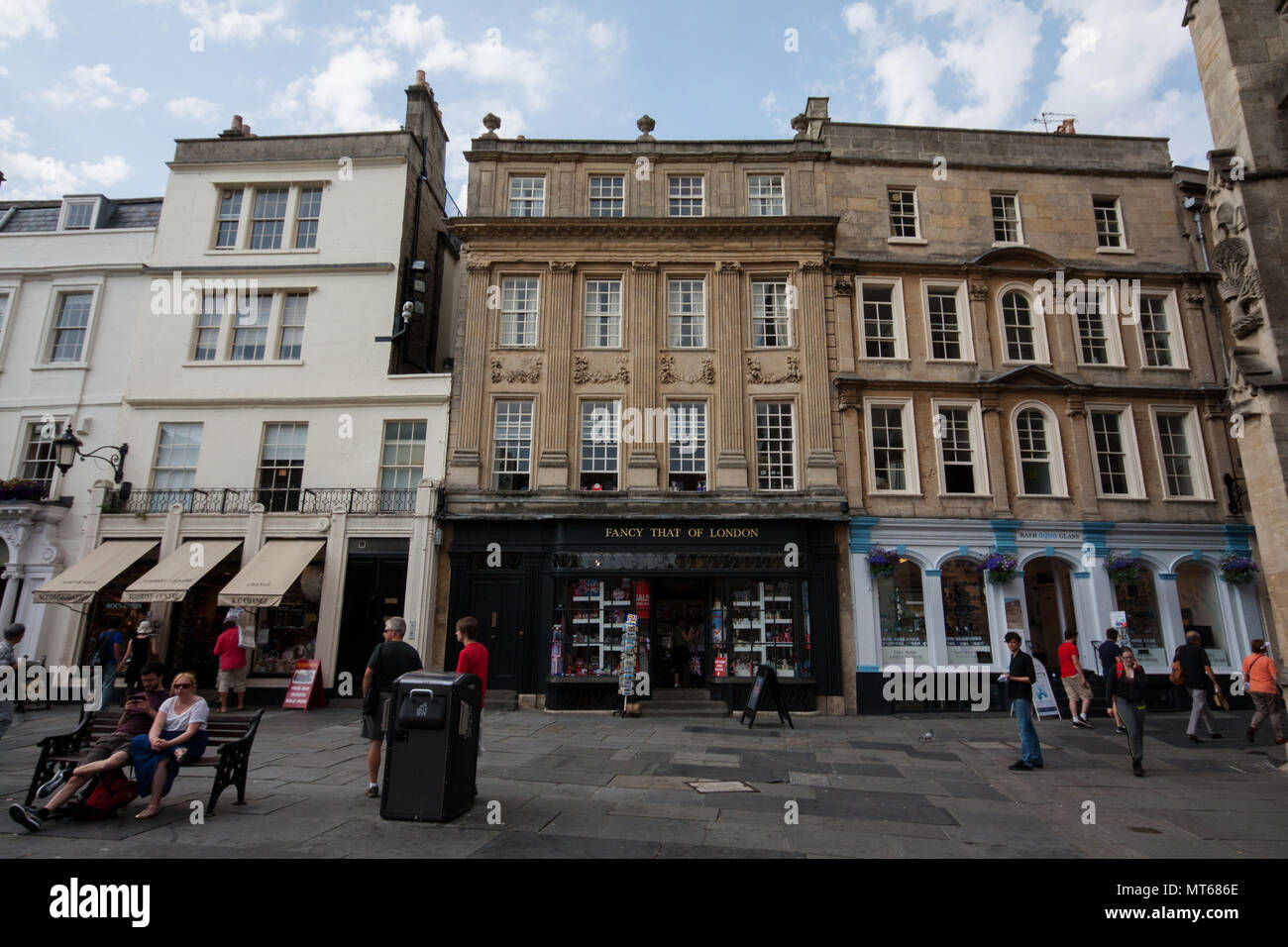 Old buildings facades with touristic stores in city of Bath, England