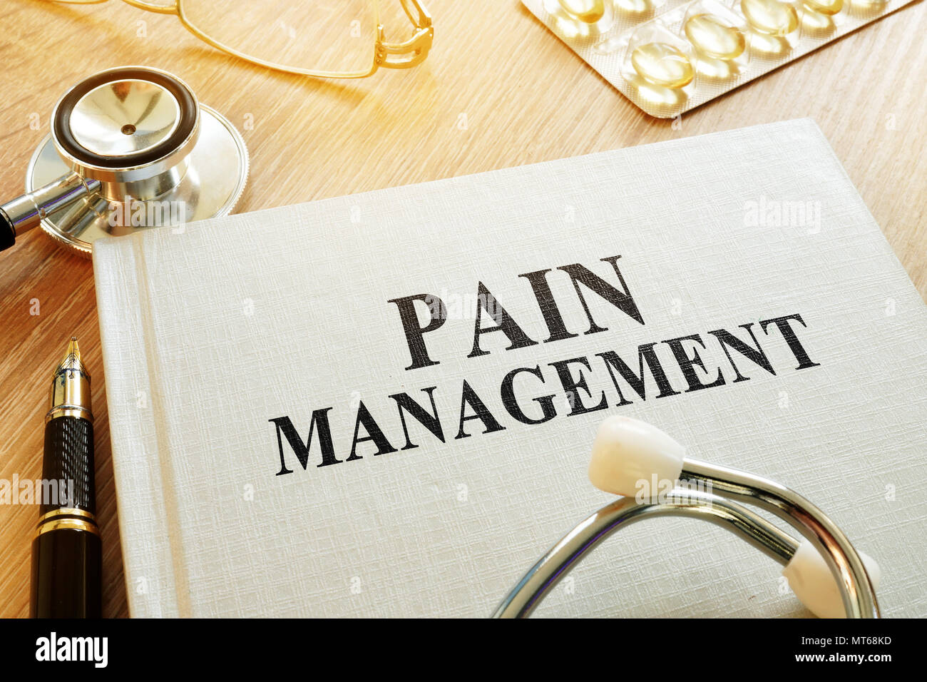 Book about Pain management. Chronic care management concept. Stock Photo