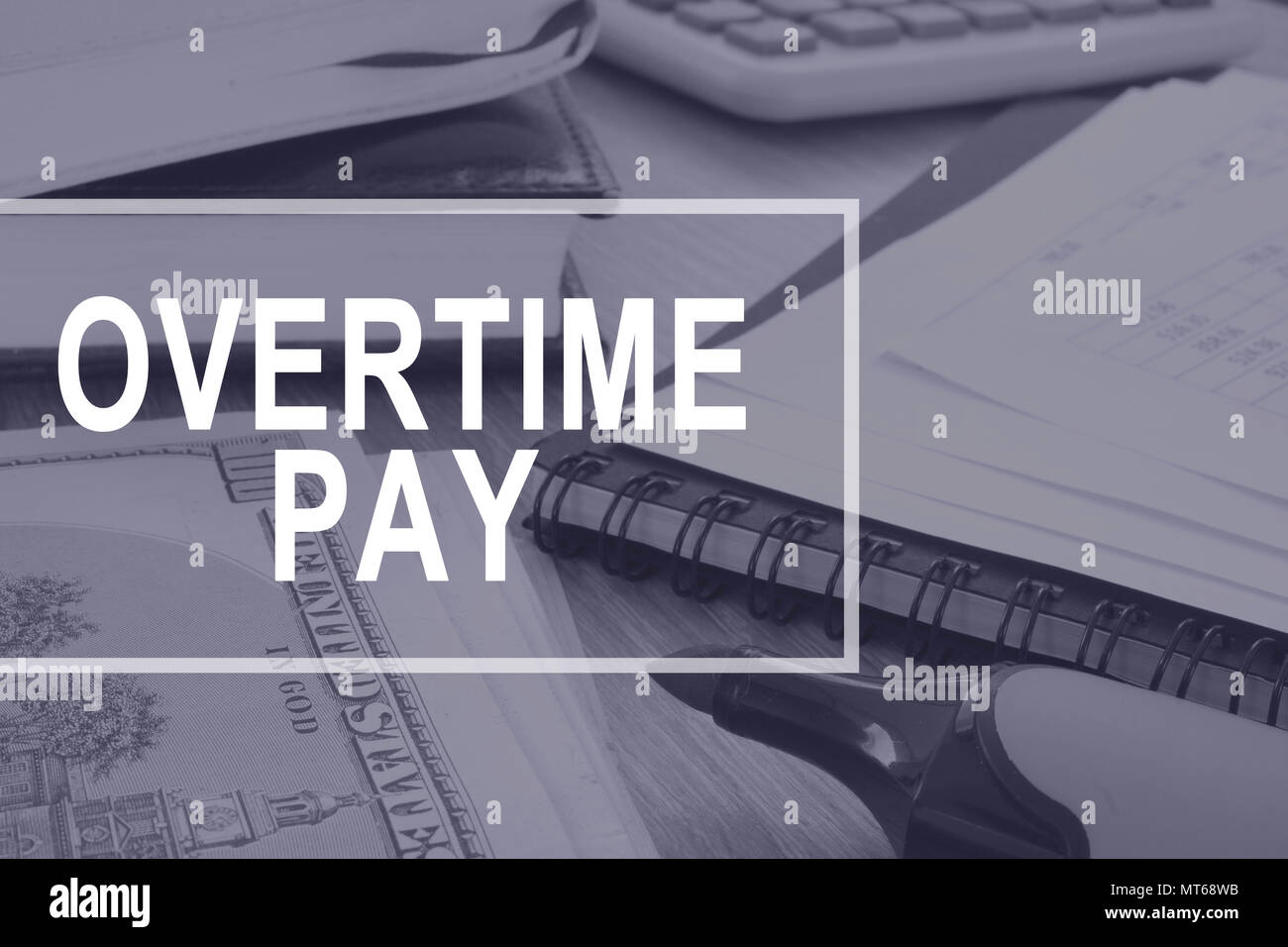 Overtime pay. Office desk with calculator and documents. Stock Photo