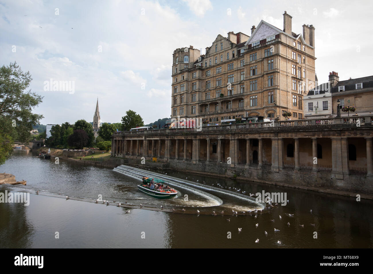 Pulteney Weir in river Avon, with Empire hotel in the background, in Bath, England, UK. Stock Photo
