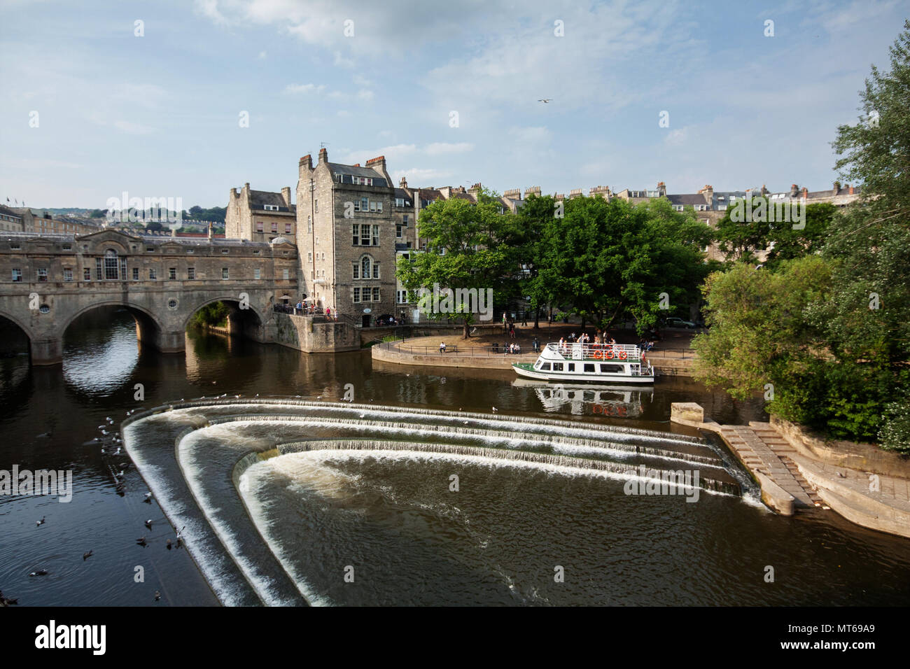 Pulteney bridge over river Avon with a tour boat, in city of Bath, England, UK. Stock Photo