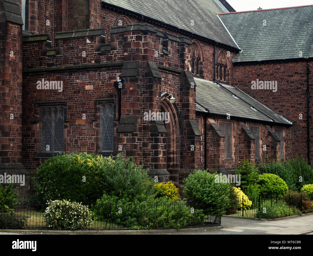 Close-up of the architecture and round bushes of the Liverpool Cathedral in Liverpool, Wales, UK. Stock Photo