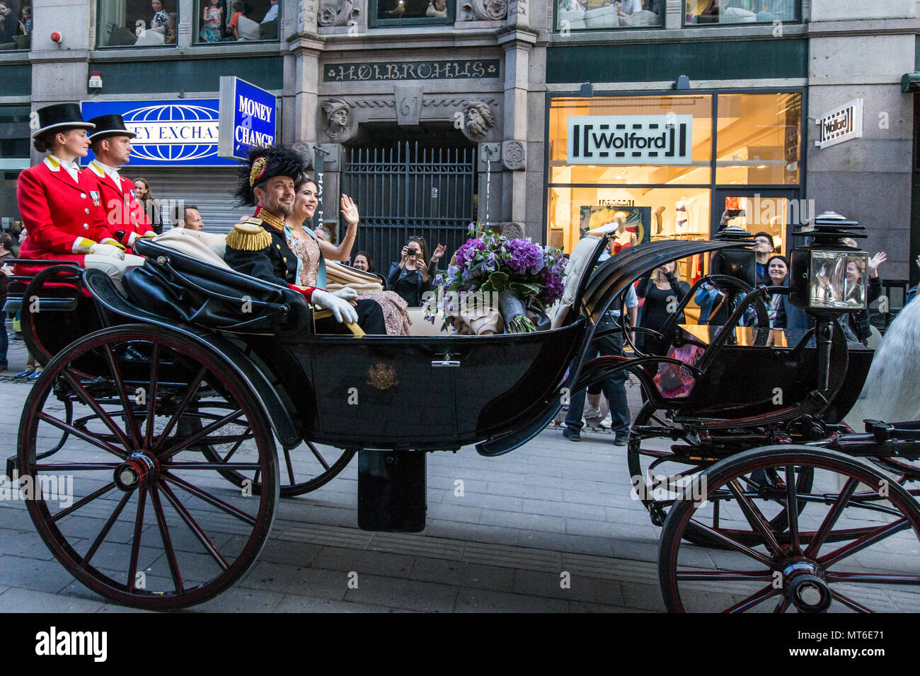 Frederik, Crown Prince of Denmark and Princess Mary are transported in a horse carriage at Strøget in central Copenhagen as part of the public celebration of Crown Prince Frederik's 50 year old birthday. Stock Photo