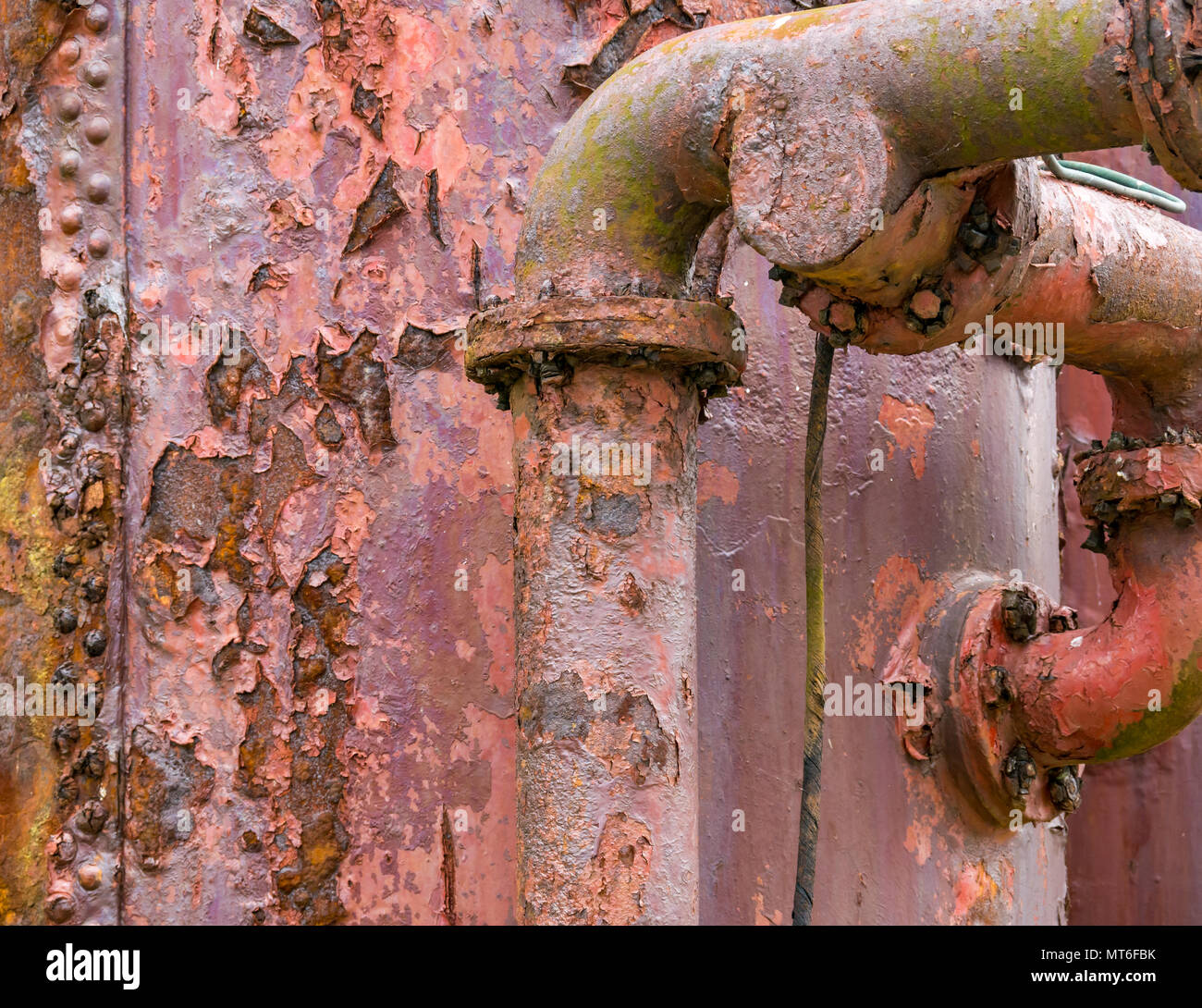 Close up of rusty very old metal tanks and pipes, Isle of May foghorn compressor, Scotland, Uk Stock Photo