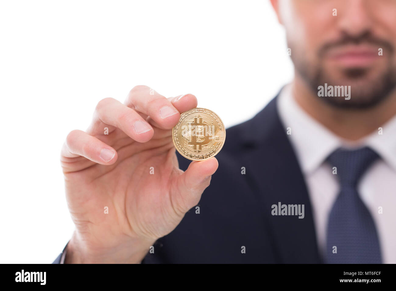 Businessman holding bitcoin isolated on white, depth of field, closeup Stock Photo