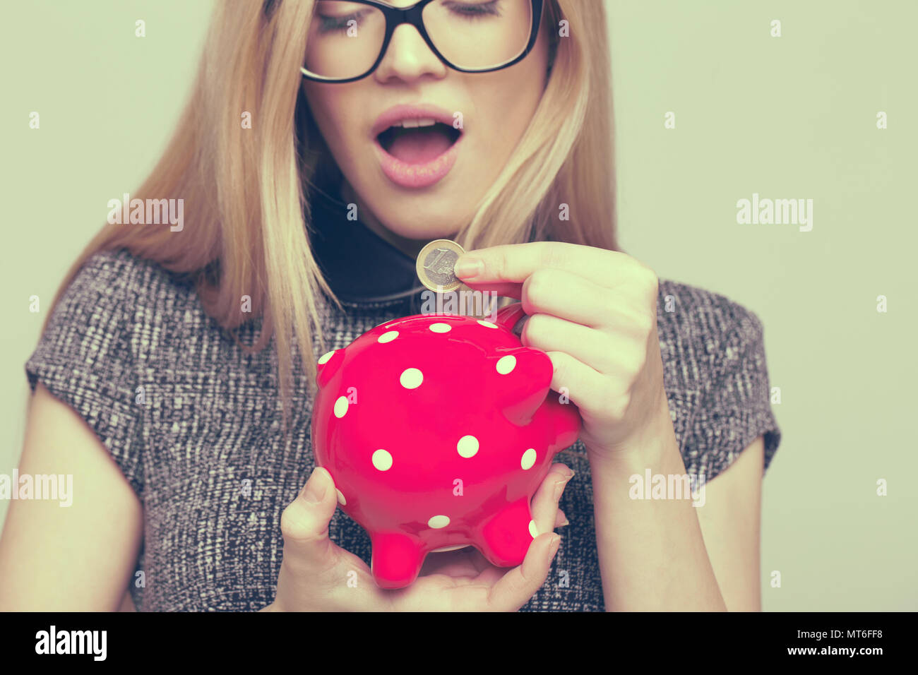 Money piggy bank woman hi-res stock photography and images - Alamy