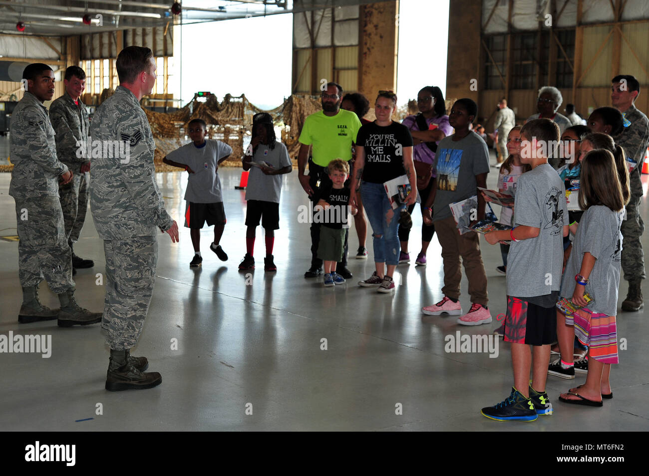 U.S. Airmen assigned to the 20th Aircraft Maintenance Squadron speak to