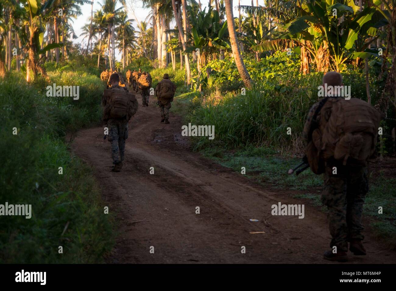 U.S. Marines with 3rd Battalion 4th Marines attached to Task Force Koa Moana 17 move to an objective during a joint service infantry training exercise as a part of Exercise TAFAKULA on Vava’u Island, Tonga, July 26, 2017. Exercise TAFAKULA is designed to strengthen the military-to-military, and community relations between Tonga’s His Majesty’s Armed Forces, French Army of New Caledonia, New Zealand Defense Force, and the United States Armed Forces.  (U.S. Marine Corps photo by MCIPAC Combat Camera Lance Cpl. Juan C. Bustos) Stock Photo