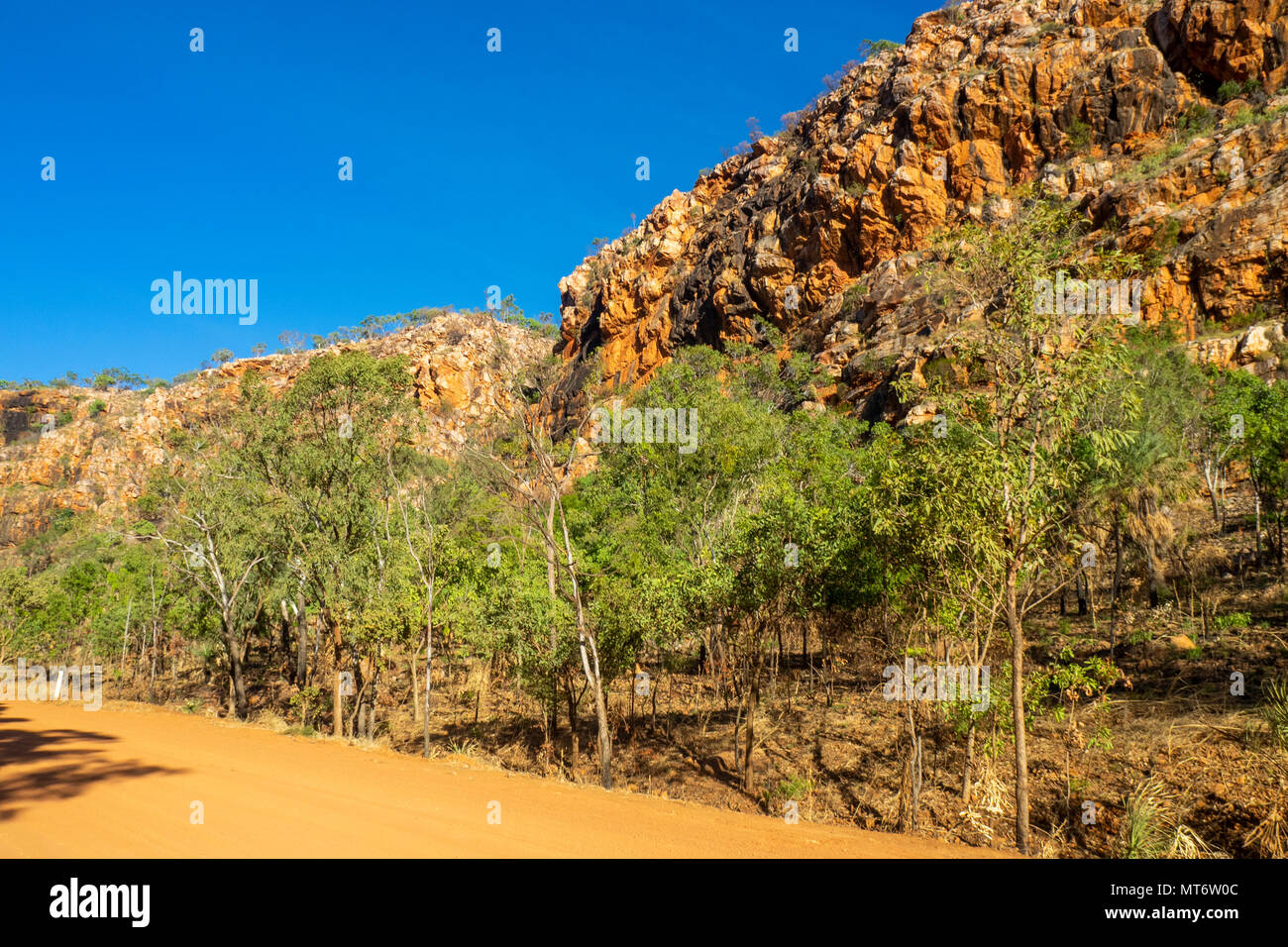 The Gibb River Road, a dirt road, passing through the red pindan cliffs of the King Leopold Ranges in the Kimberley, WA, Australia. Stock Photo