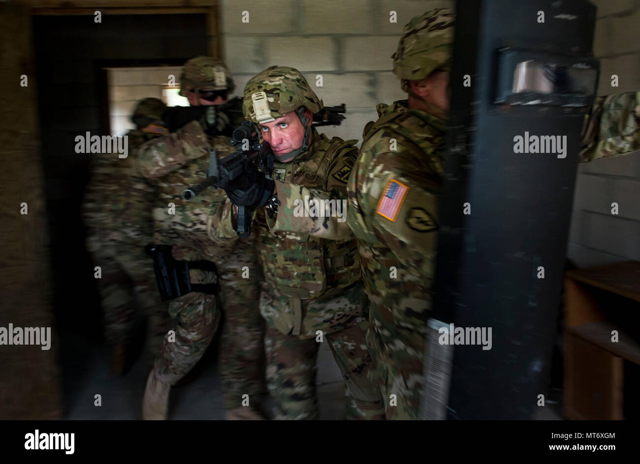 Sgt. 1st Class Ronald Clifton (center) clears a room with fellow U.S ...