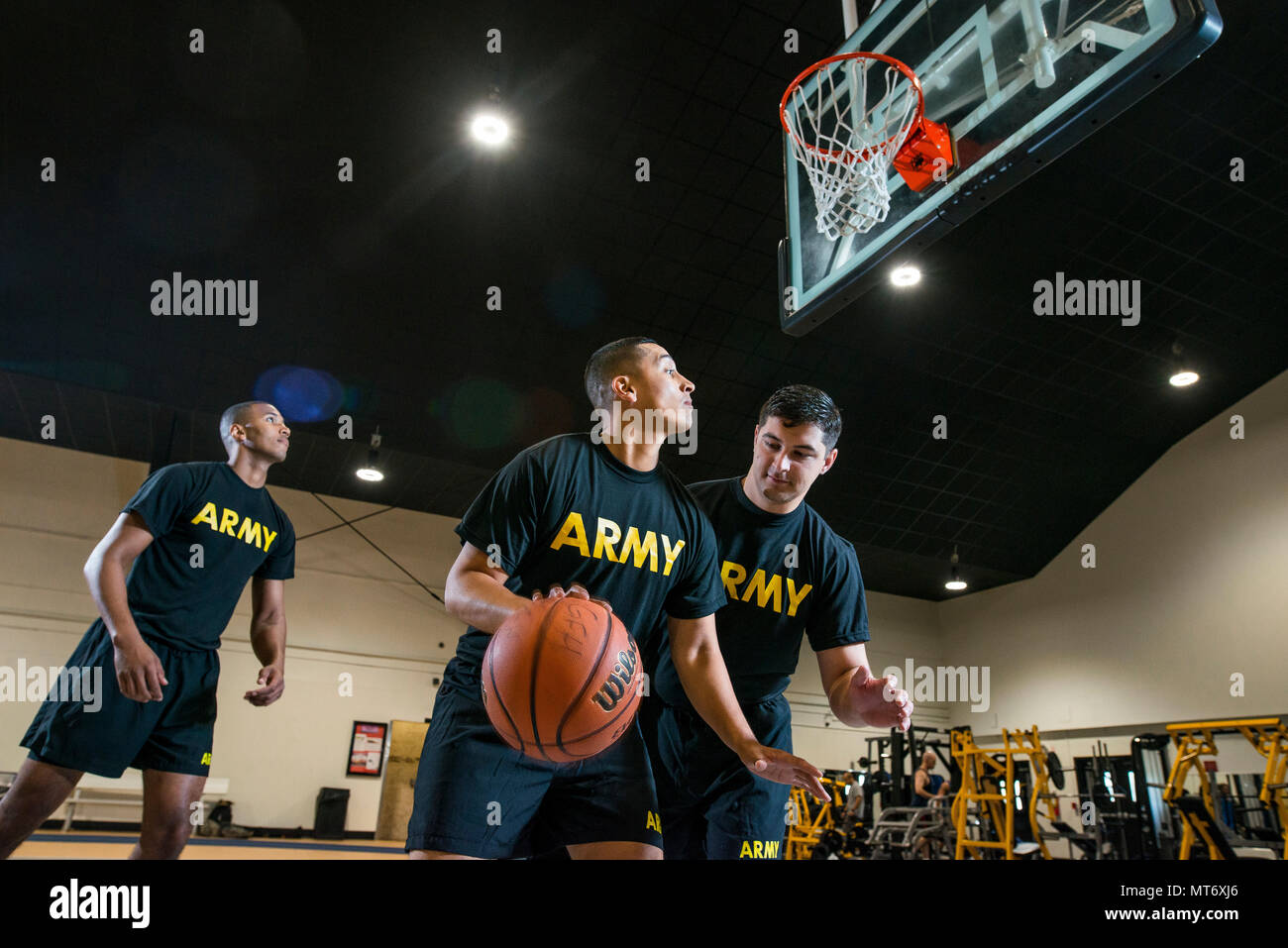 A U.S. Army Reserve Soldiers play basketball as part of a fitness photo