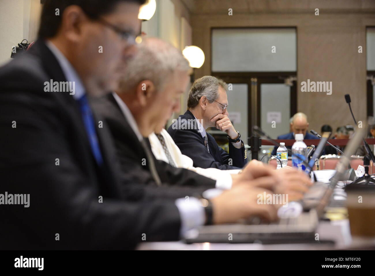 Members of the parties in interest, including the American Bureau of Shipping and Herbert Engineering, prepare to hear testimony Thursday, Feb. 9, 2017, during the final S.S. El Faro Marine Board of Investigation hearing in Jacksonville, Florida. Along with the official panel, other parties in interest were present to direct questions to different witnesses. U.S. Coast Guard photo by Petty Officer 2nd Class Anthony L. Soto Stock Photo