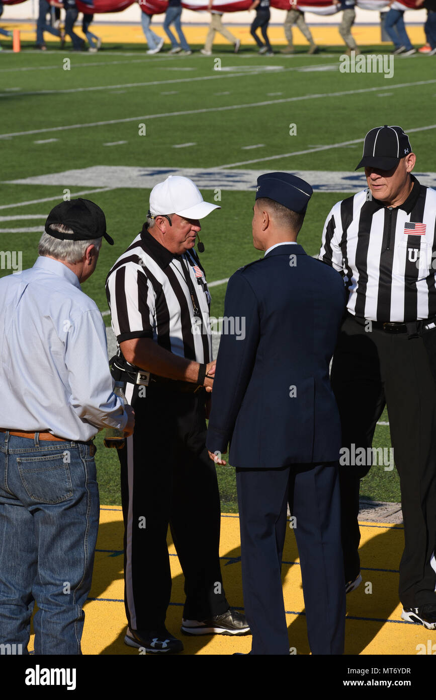 U.S Air Force Col. Ricky Mills, 17th Training Wing commander, greets the referees during the Military Appreciation Day game at Angelo State University’s LeGrand Stadium in San Angelo, Texas, Sept. 9, 2017. The game was between ASU and Northern Michigan University and was a rematch of last year’s ASU victory. (U.S. Air Force photo by Airman Zachary Chapman) Stock Photo