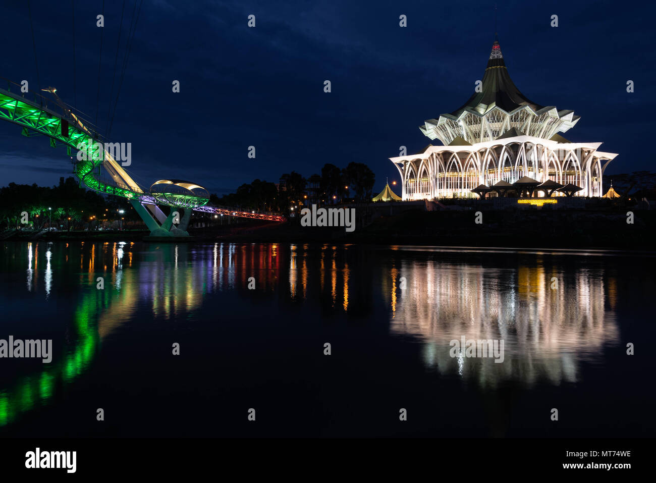 Kuching waterfront at night with the Sarawak River and National Assembly Building Stock Photo
